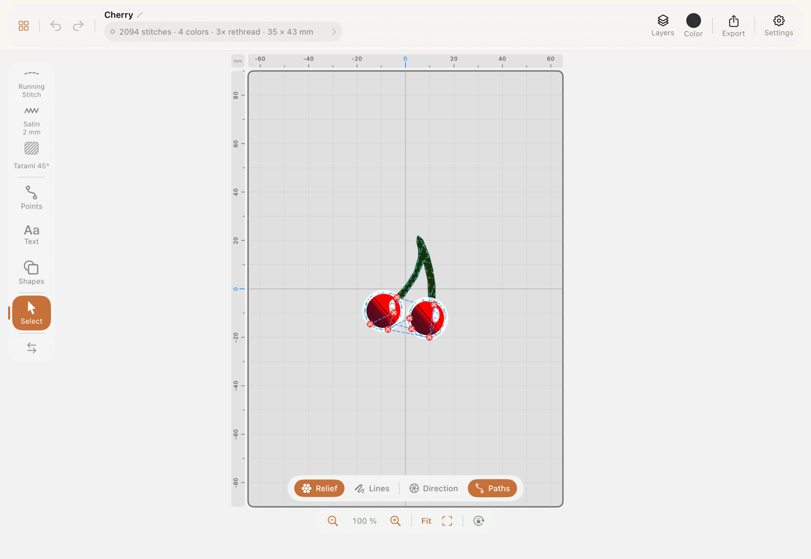 The StitchPencil canvas with a cherry design, tool rail on the left and the view toggles below